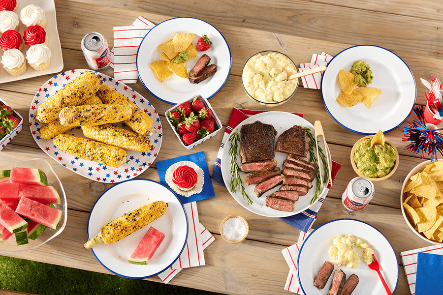fourth of july bbq food with steak corn on the cob desserts and sides