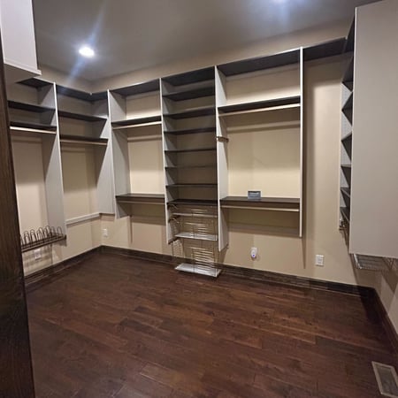 Greensboro - Custom closets - media center with cabinets and shelves surrounding a TV