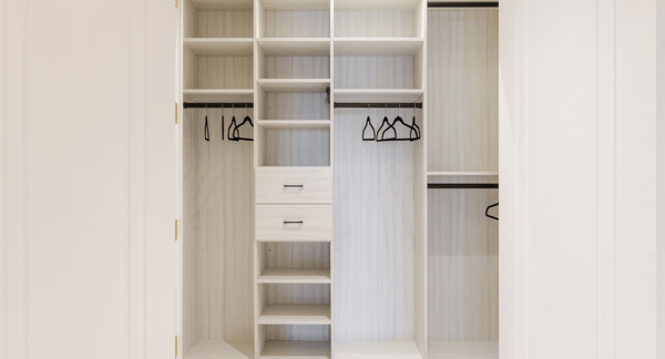 California Closets New York NY White Reach-in Closet with Shelving, Hanging, and Black Hanging Rods