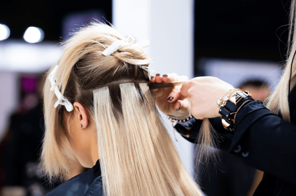 Hair extensions being installed at a Hair Cuttery salon