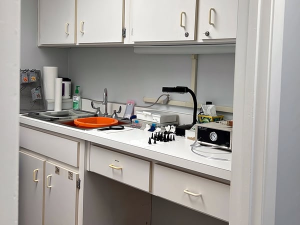 Interior photo of the hearing aid lab for AudioNova hearing clinic in Tavares, FL