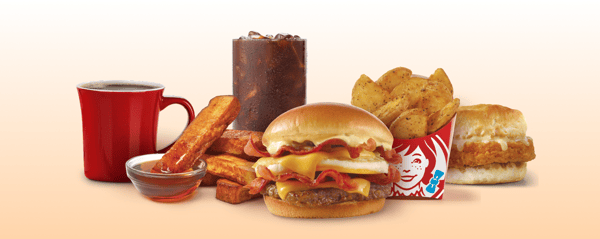 Wendy’s Baconator, Wendy’s Seasoned Potatoes, Wendy’s Homestyle French Toast Sticks, Wendy’s Premium coffee, Coca-Cola soft drink.