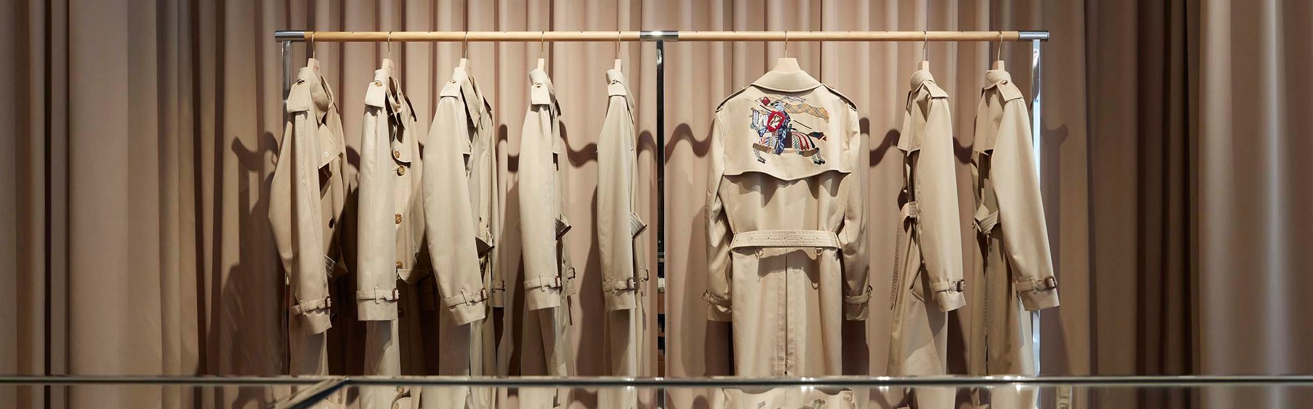 Close up of Burberry trench coat display.