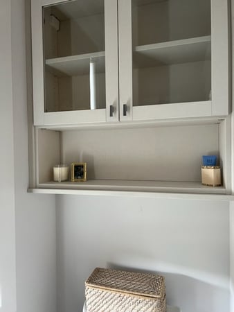 Custom bathroom storage with glass cabinets
