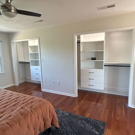 Greensboro - Custom closets - two open concept bedroom closets with built-in floating shelves and drawers