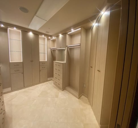 Large walk-in master closet with maximized space usage and application of lighting