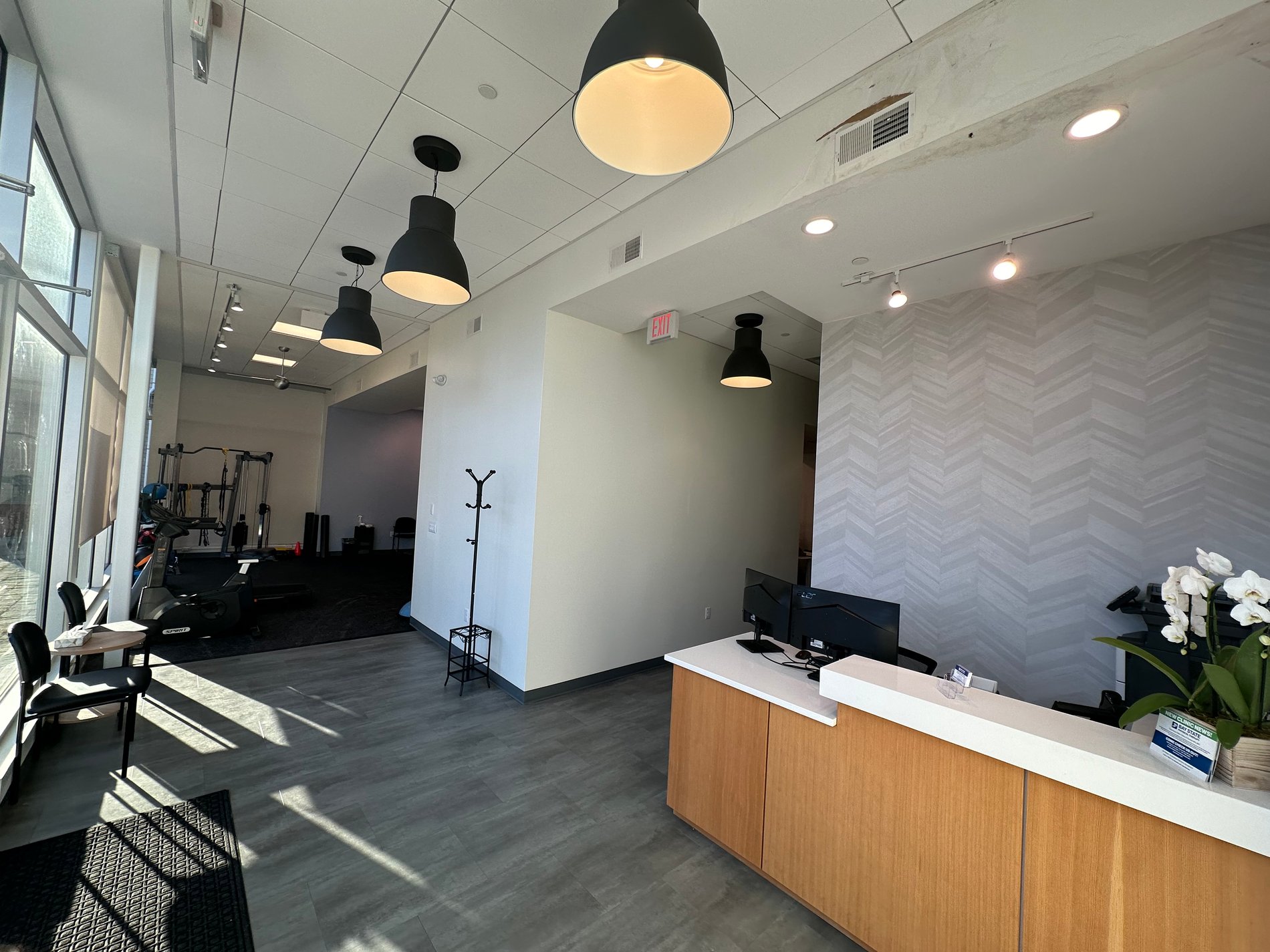 Front Desk and waiting room area Bay State PT - Somerville, MA