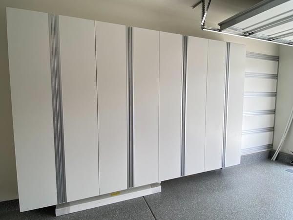 White garage workspace storage with silver accents