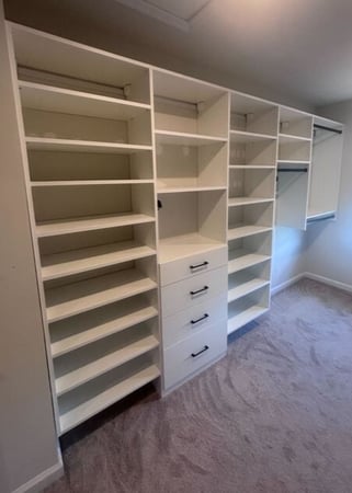 Virginia Beach - Custom closets - Walk-in closet with dual hanging rods and open shelving in neutral tones.