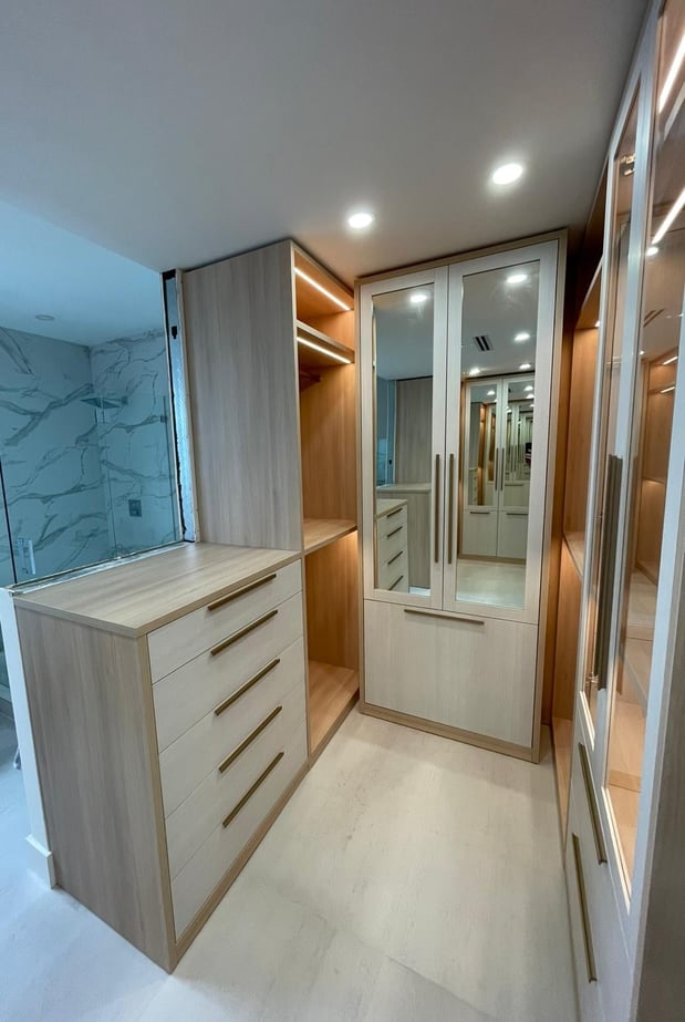 Luxe walk in closets with mirror inserts, lighting and glass doors!