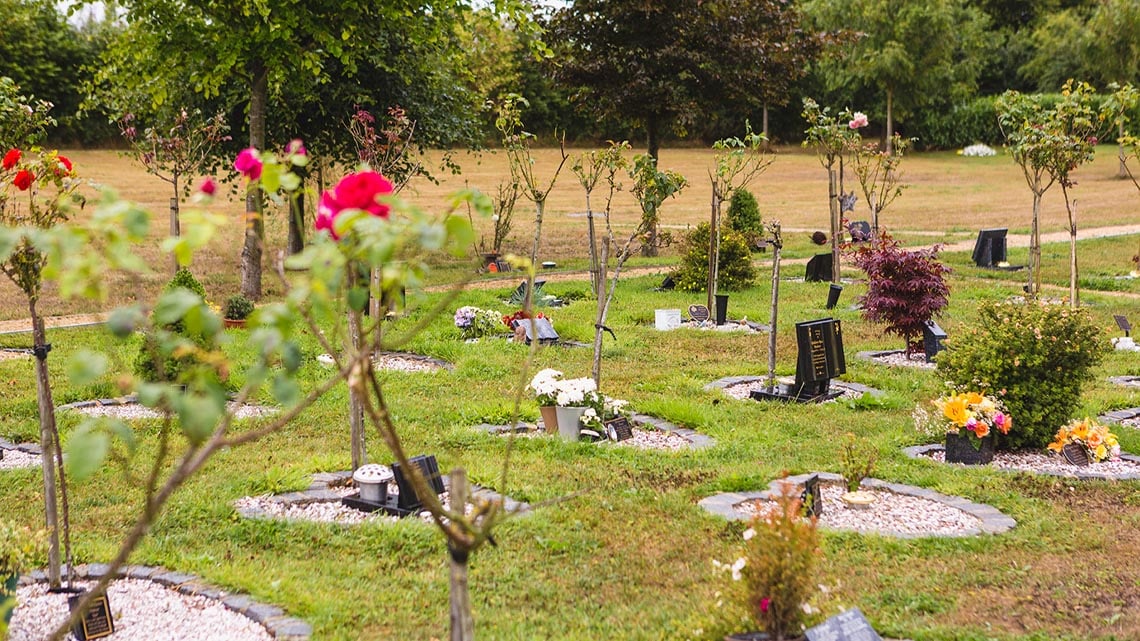 Various memorials marking funeral plots where ashes are buried