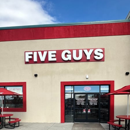 Exterior photograph of the Five Guys restaurant at 1400 Dell Rand Boulevard in Cheyenne, Wyoming.