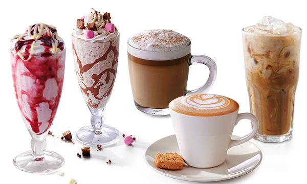 A collection of drinks including coffee and milkshakes next to each other against a white background.