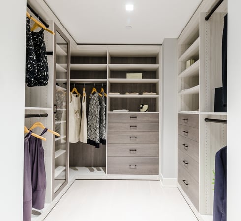 Walk-in closet california closets new york westchester gray with chrome gray handles clear door closed storage hanging, shelves