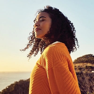 Woman is thinking about AudioNova's solutions for her tinnitus in Tyler, TX