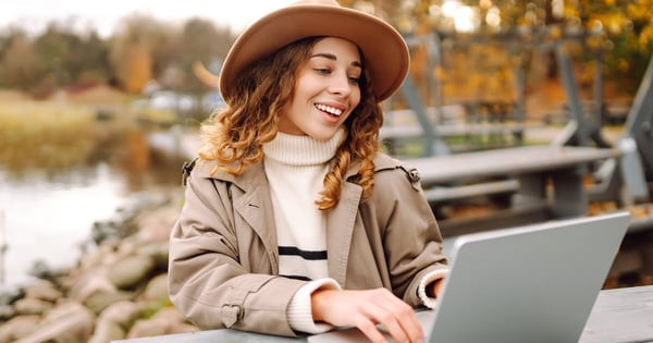 woman laptop park