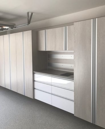 Grey garage workspace storage with white accents