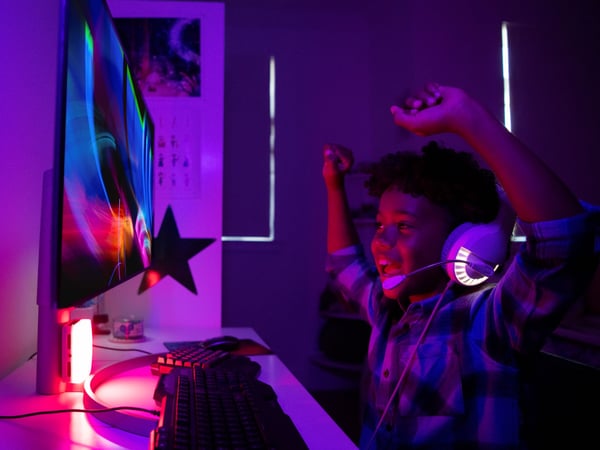 Teen boy gaming at home in Winter Park, FL