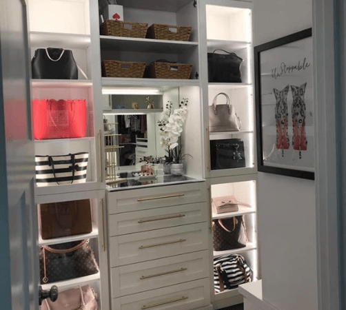 Closet shelving and drawers to store accessories.