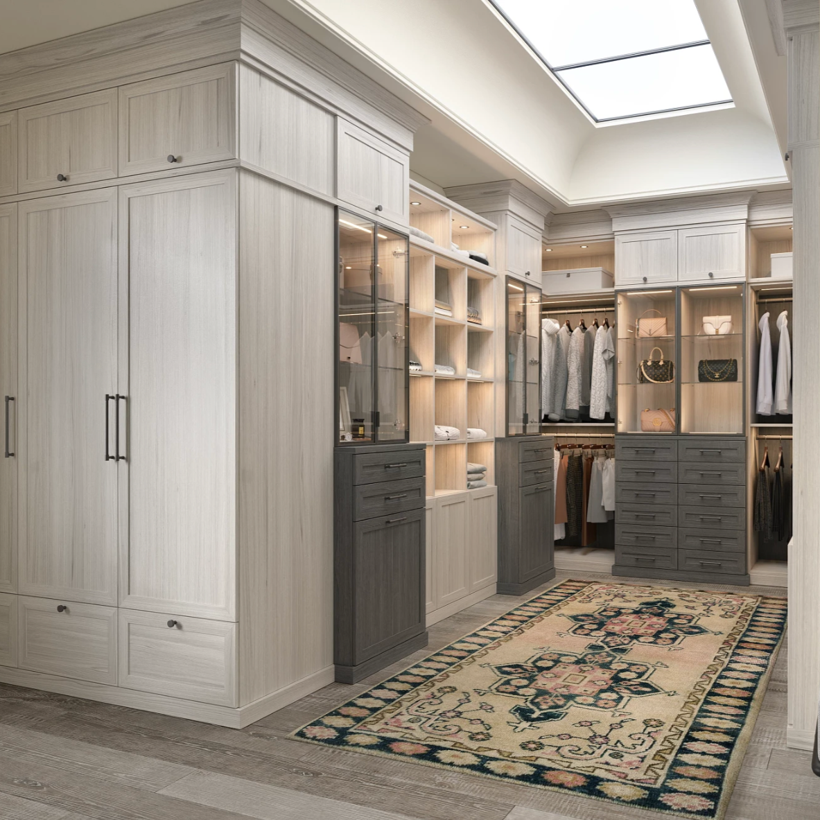 Custom wardrobe with floor-to-ceiling storage, drawers, shelving, hanging space, and integrated lighting.