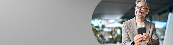 A man n Lake Worth with smiles when booking his hearing appointment at AudioNova's