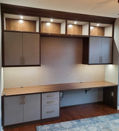 home office desk, cabinets and drawers with lighting in complementing finishes