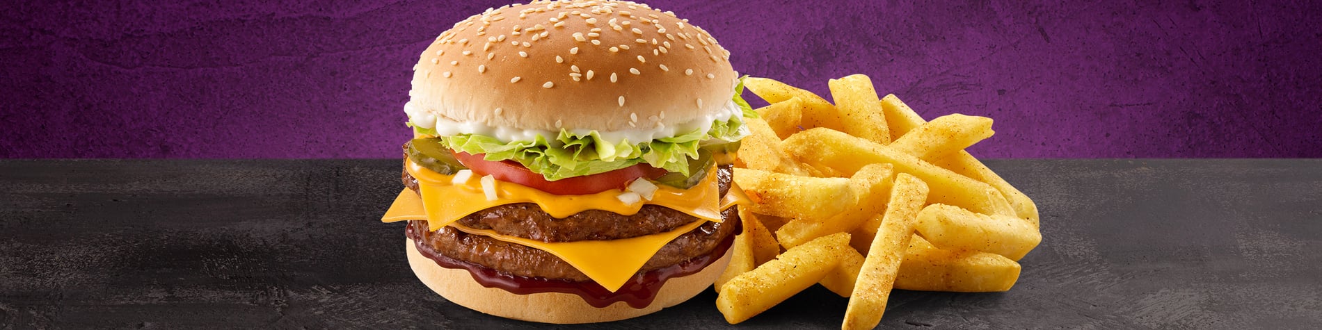 King Steer® Burger Meal from Steers®. A double cheese burger with a portion of chips on a granite surface.