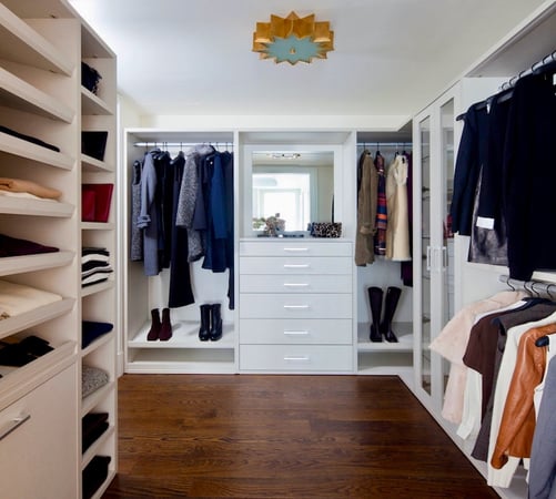 custom walk in closet with drawers, and hanging space