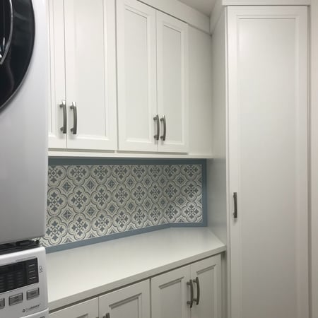 LAUNDRY room on an ANGLED WALL with LEXINGTON FRAMEs in DOVE with CUSTOM HANDLES