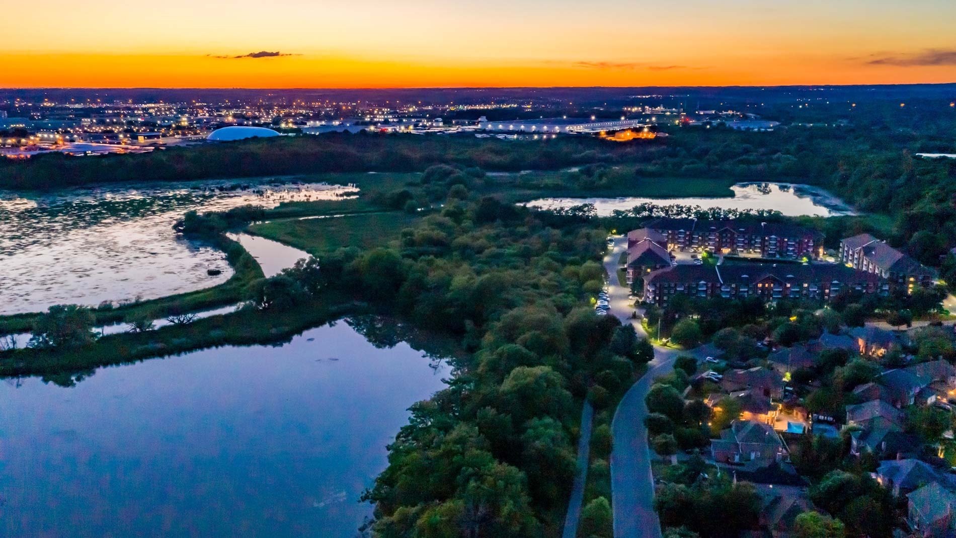 Aerial view of Duffins South Trail and Duffins Creek in Rotary Park at dusk in Ajax, Ontario.