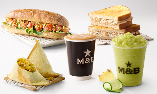 Takeaway lunch meals from Mugg & Bean On-The-Move Durban Club Place OTM including a Chicken Mayo Toasted Sandwich, a Roasted Tomato & Basil Pesto Baguette, a Spicy Potato & Cheese Filler, takeout coffee, and a cold refreshing drink called Cucumber & Pineapple Slush.