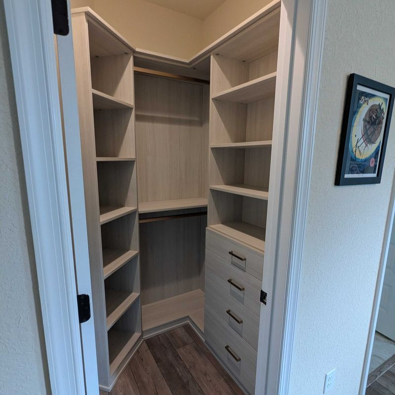 Virginia Beach - Custom closets - Compact corner closet with open shelving, drawers, and hanging space.