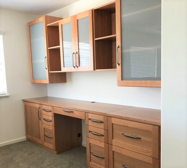 Desk and cabinets in Cherry wood veneer with semi-opaque glass inserts.