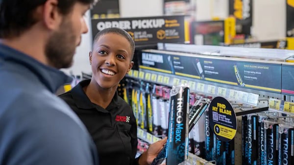 Advance Auto Parts team member assisting a customer with picking the correct wiper blades