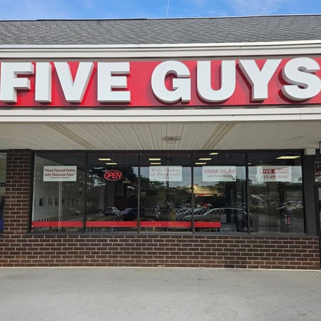 Exterior photograph of the Five Guys restaurant located in Pittsfield, Massachusetts.
