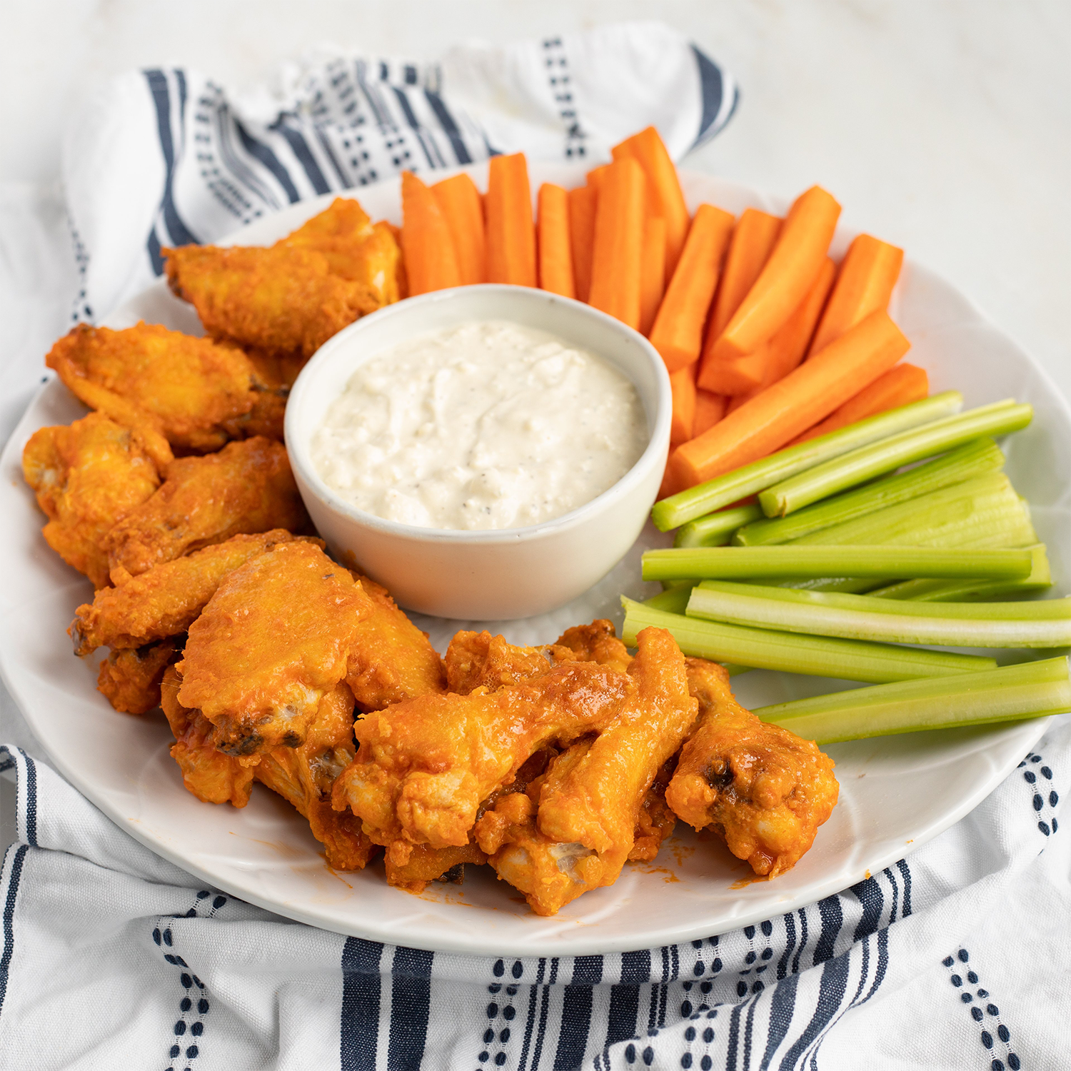 buffalo wings with carrots celery and homemade blue cheese dressing