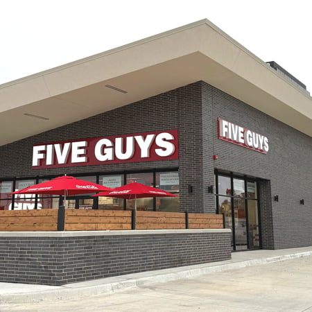 Exterior photograph of the Five Guys restaurant at 5201 North May Avenue in Oklahoma City, Oklahoma.