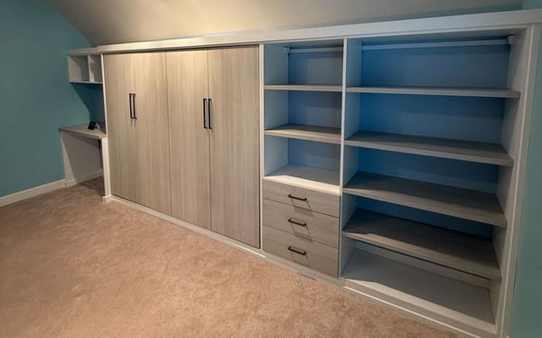 Wilmington - Custom closets - Murphy bed wall system with storage shelves and drawers in light wood.