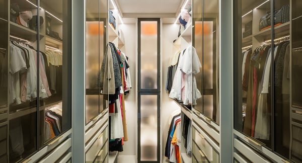 Modern women's walk-in closet custom designed by California Closets Nassau County, New York