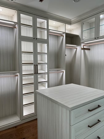 White Walk-In closet with Island & Lighting