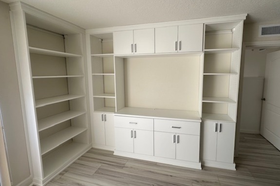 Media center in Dove finish with matte aluminum hardware.
