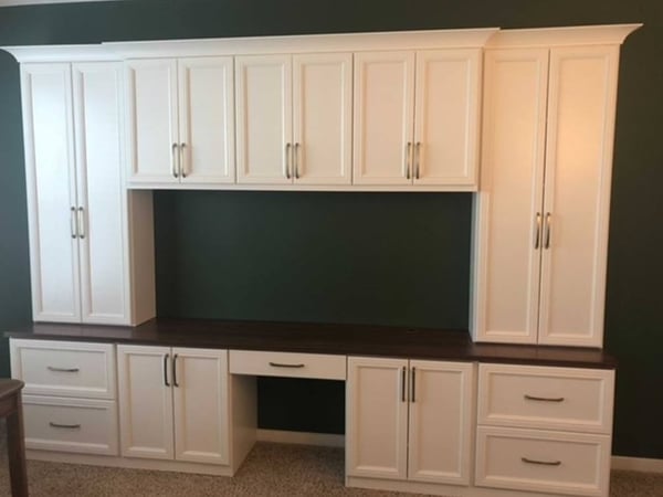 Richmond - Custom closets - Home office desk with cabinets and drawers with a cutout in the center for a computer setup