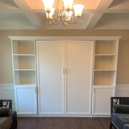 Greensboro - Custom closets - Closed Murphy bed unit with white bookshelves on each side