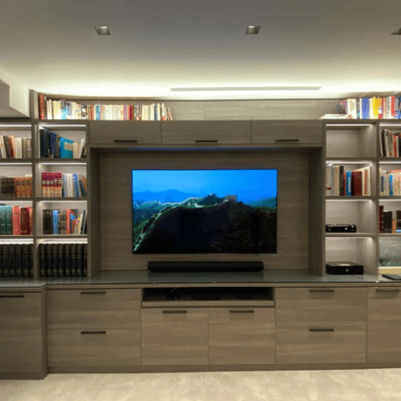 Custom media center with shelving and pull-out storage in Salisbury, MD by California Closets of Philadelphia and Delaware