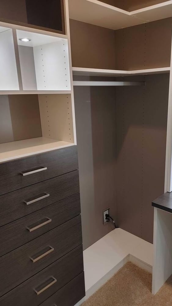 Custom walk-in closet fit into a corner