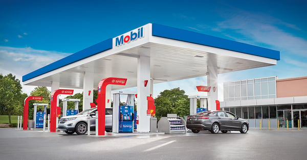 Blue, Mobil gas station in daytime with synergy+ fuel pumps