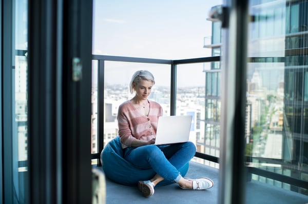 Woman on balcony streaming a movie