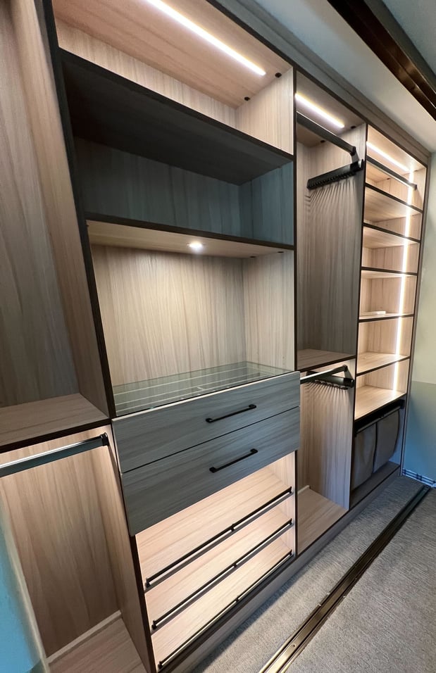 Reach in closet with hanging space and drawers for organizing coats and accessories