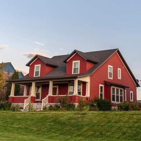 A red house with a lawn