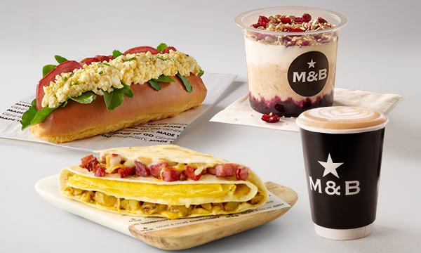 Takeaway breakfast and brunch meals including a Macon & Egg Mayo Roll, Breakfast Fold, Oat Pot, and a takeout coffee from Mugg & Bean On-The-Move Total Beyers Naude OTM Express.